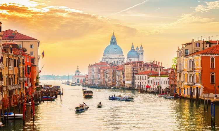 Venice, Italy will capture your imagination as an overnight destination when traveling from Paris to Rome by train.